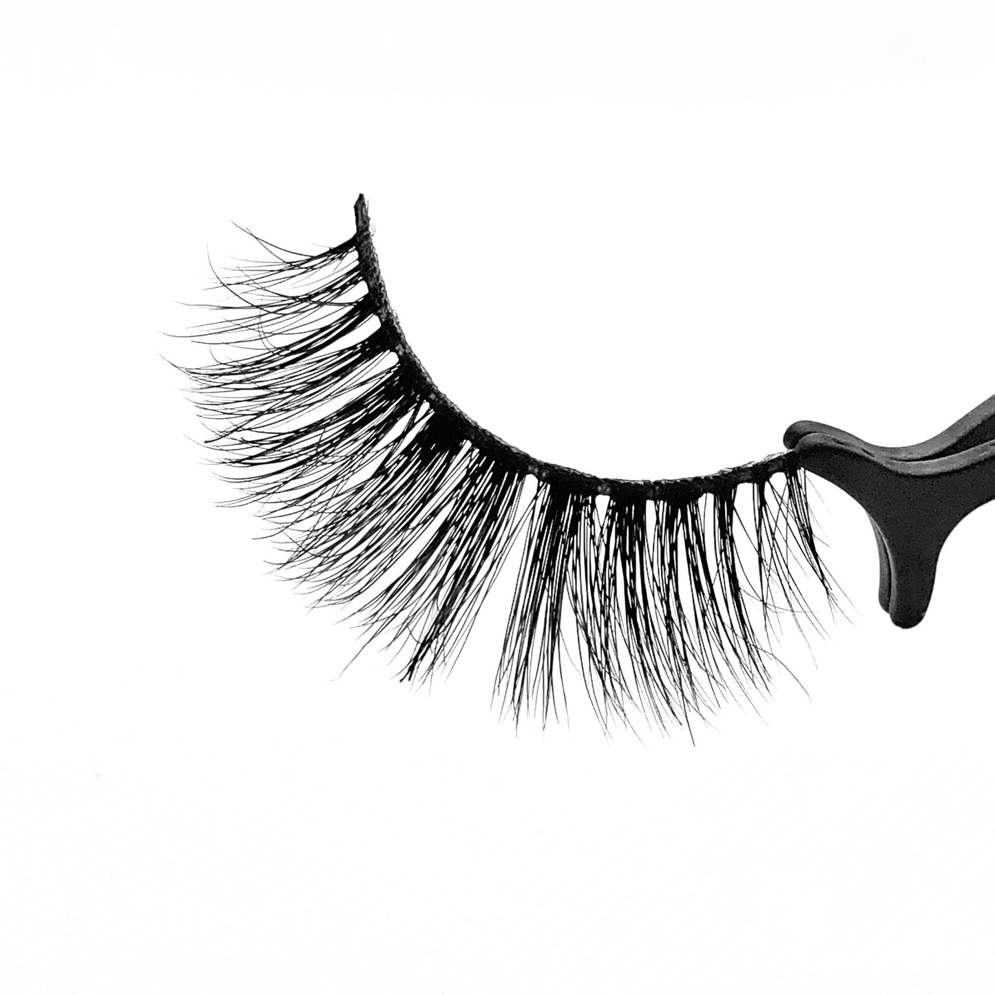 Jasmine-Medium Volume-Our 3D Mink Lashes in style “Jasmine” are a MUST HAVE. Grab a pair of "Jasmine" lashes to achieve a subtle, but “flirty” look. Whether it’s date night or a day out with the girls, these lashes are a staple to your beauty collection. They give you the perfect volume and suite most eye shapes. The longer hairs in the center create a beautiful effect to help bring out your eyes more. Also available in our "Best Sellers (3-Pack)" Description: Handmade, Cruelty-Free, Wear up to 