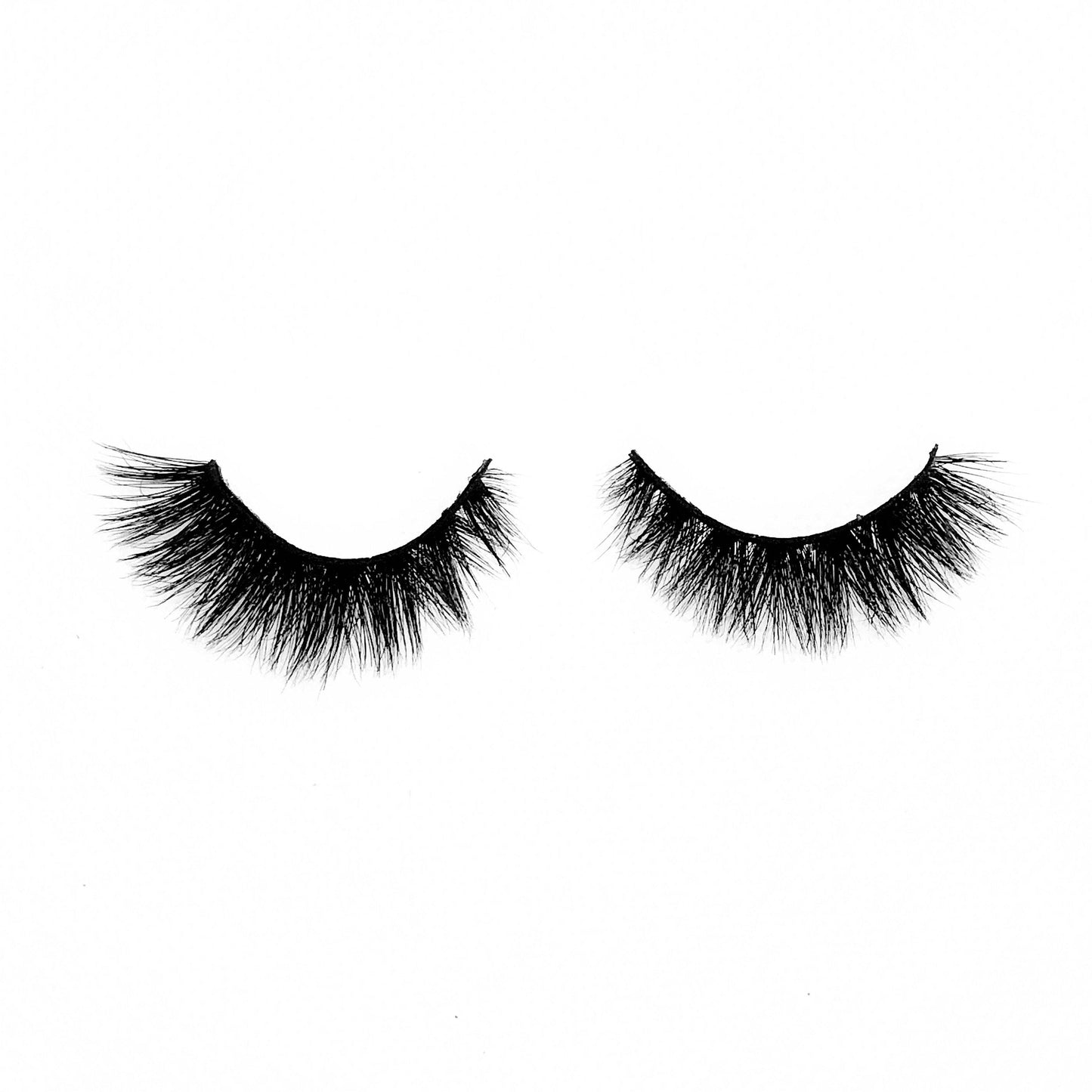Amour-High Volume-"Amour" is the perfect short length and volume combo for full, fluffy, and flirty 5D mink lashes. Super lightweight, comfortable, and versatile for any occasion. With a slightly shorter inner corner to mimic your natural lashes, they add the perfect glam to your look without being too extra. Try our "Finesser" lashes for a longer look! Description Handmade, Cruelty-Free, Wear up to 30x Material: 100% Mink Band: Black Cotton Band Volume: High Style: Short, Flirty, Cat-eye, Drama